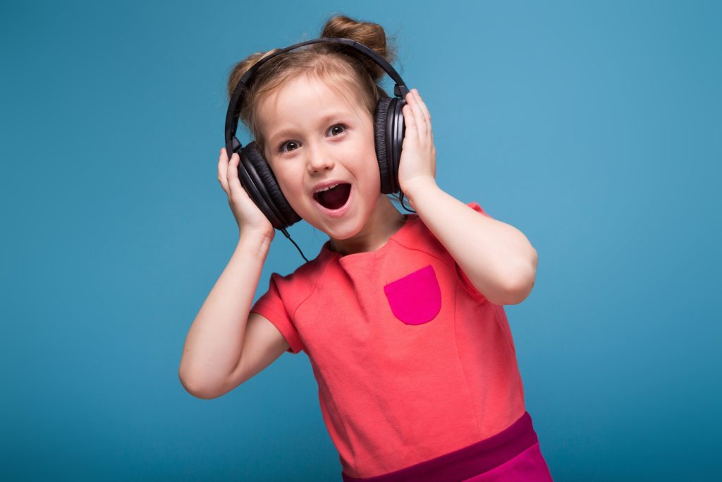 little girl with headphones on